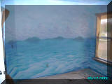 mural artist James Labadie - Kids Pirate Ship mural clouds and water with islands, left side